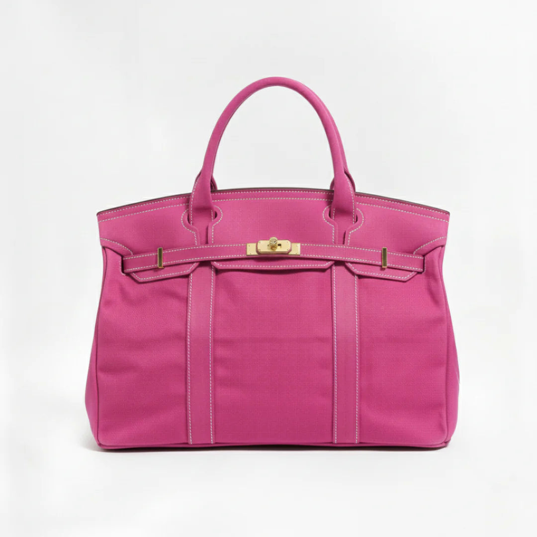 Pink canvas tote bag with gold-tone hardware