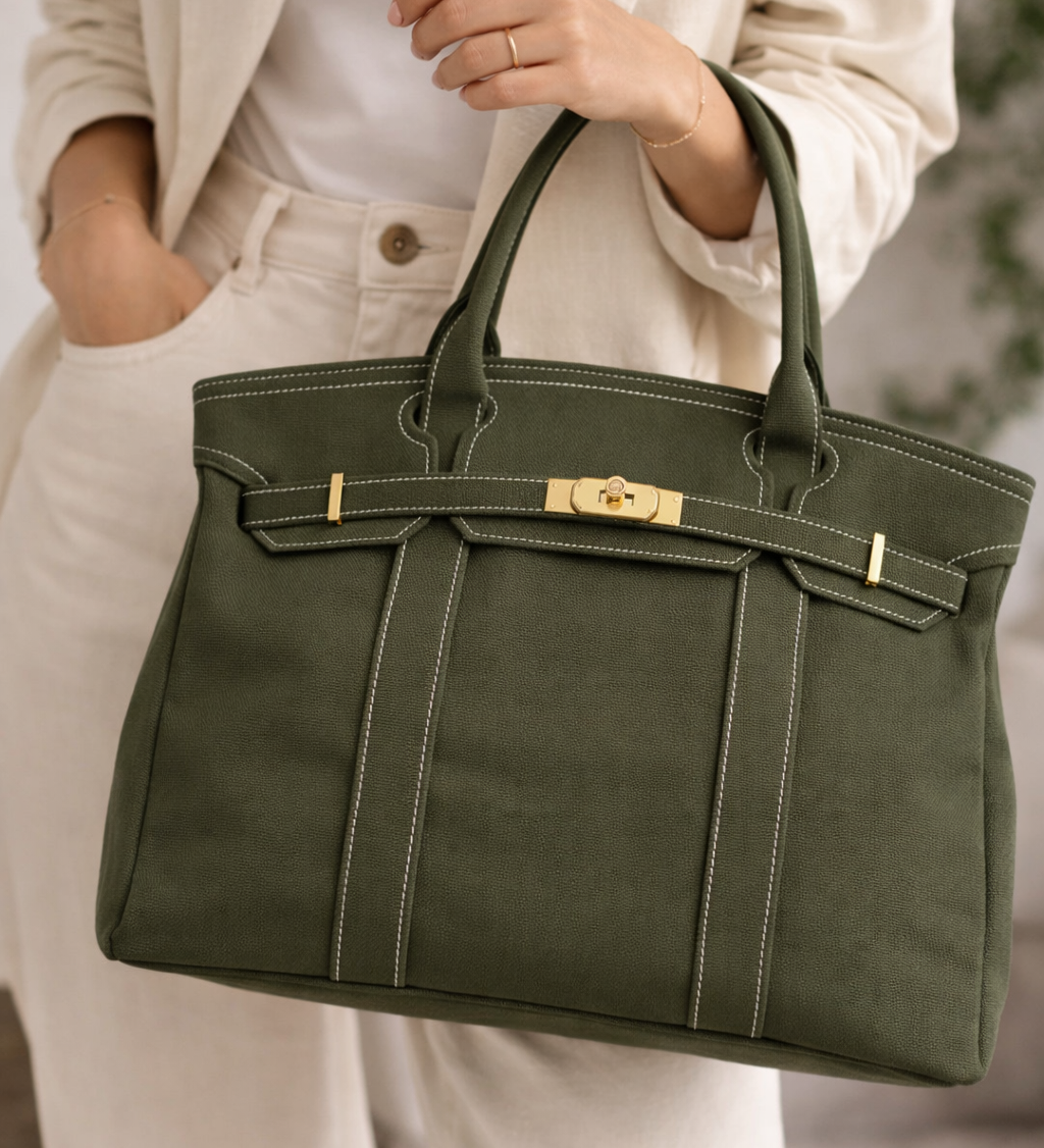 Olive green canvas tote bag carried by model
