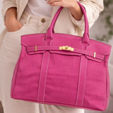 Pink canvas tote bag carried by model
